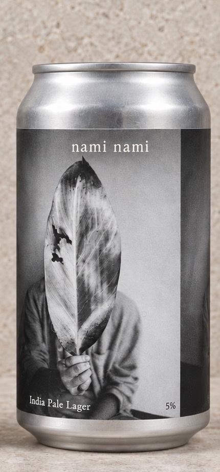 nami nami can with a black-and-white photograph of a figure holding a large leaf in front of their face.